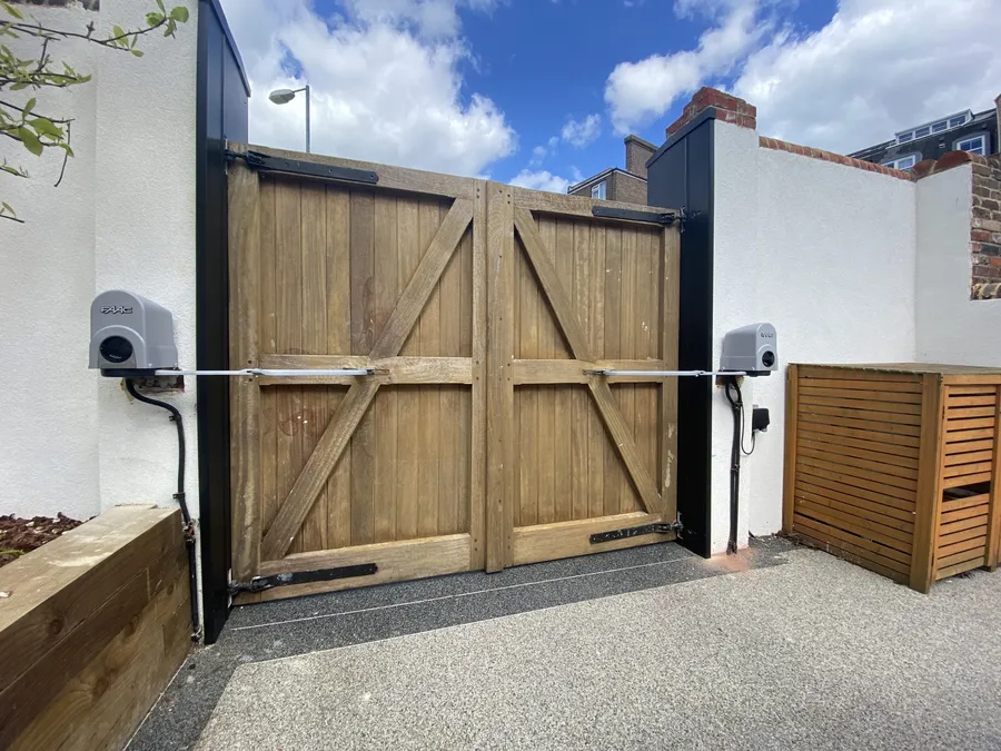 Articulated arm motors on existing gates
